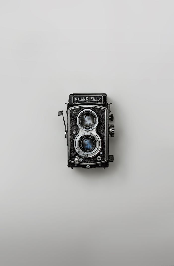 services-03 Classic Rolleiflex camera showcased against a simple background, emphasizing nostalgia and vintage design.